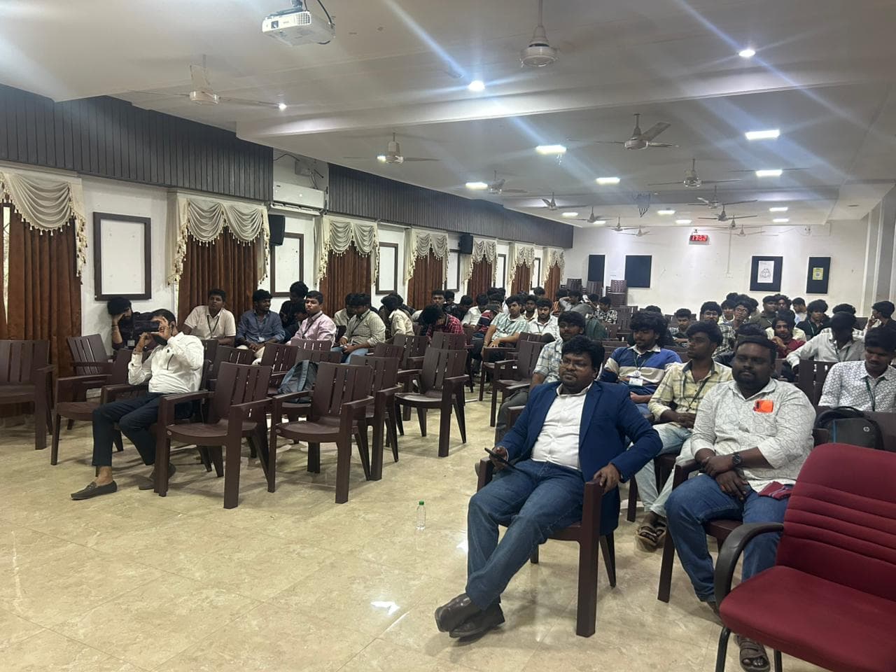 Large group of college students seated in an auditorium