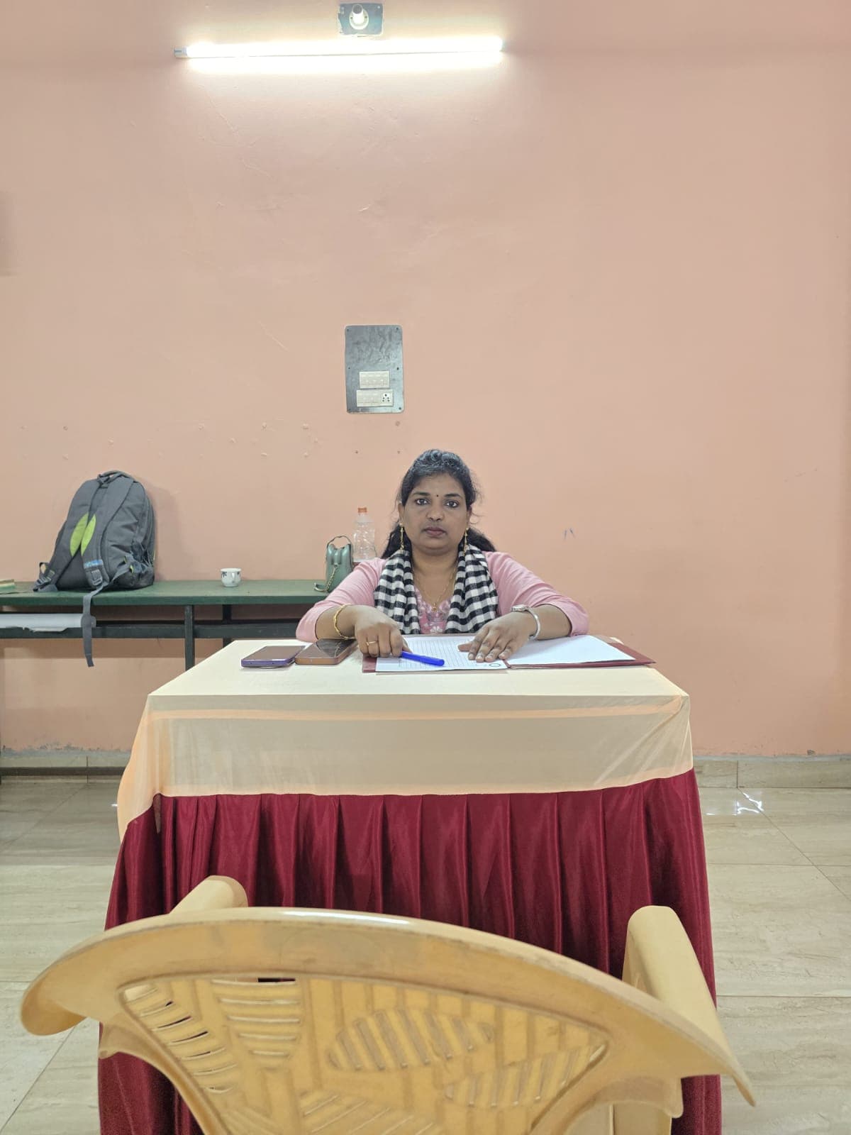 Facilitator seated at an interview desk during a college placement drive