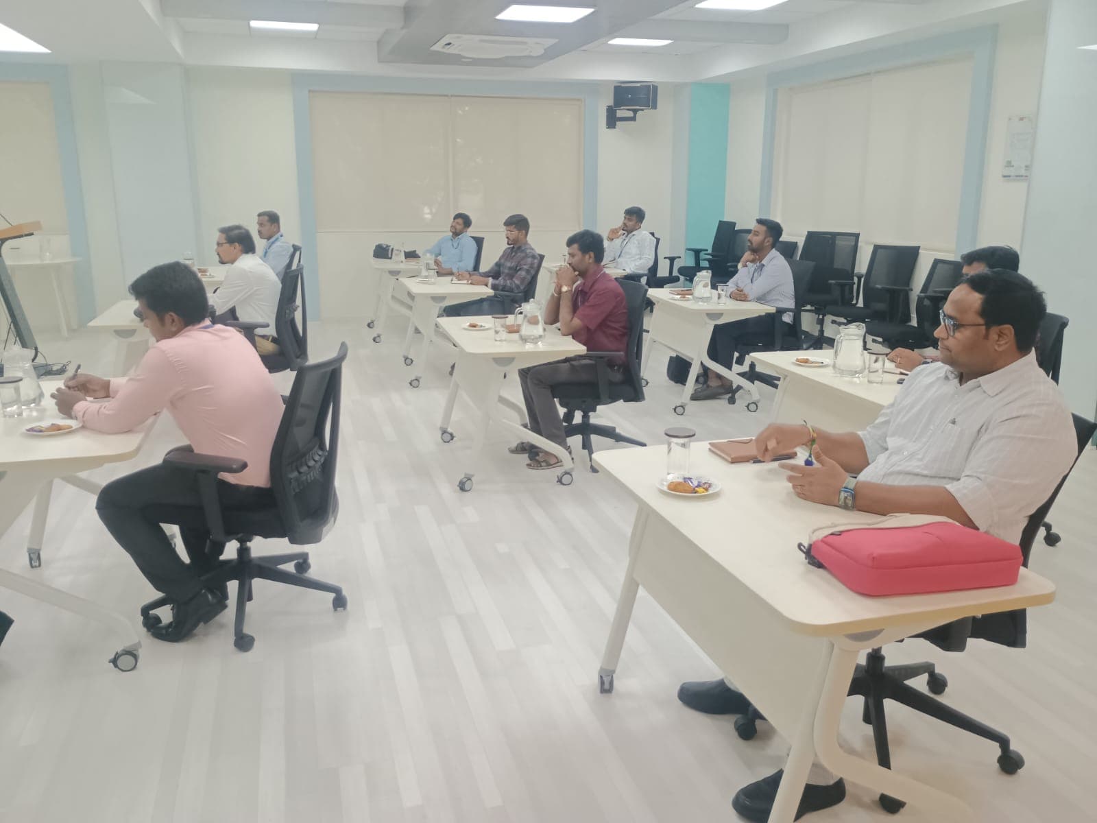 Participants seated at desks during a corporate assessment session