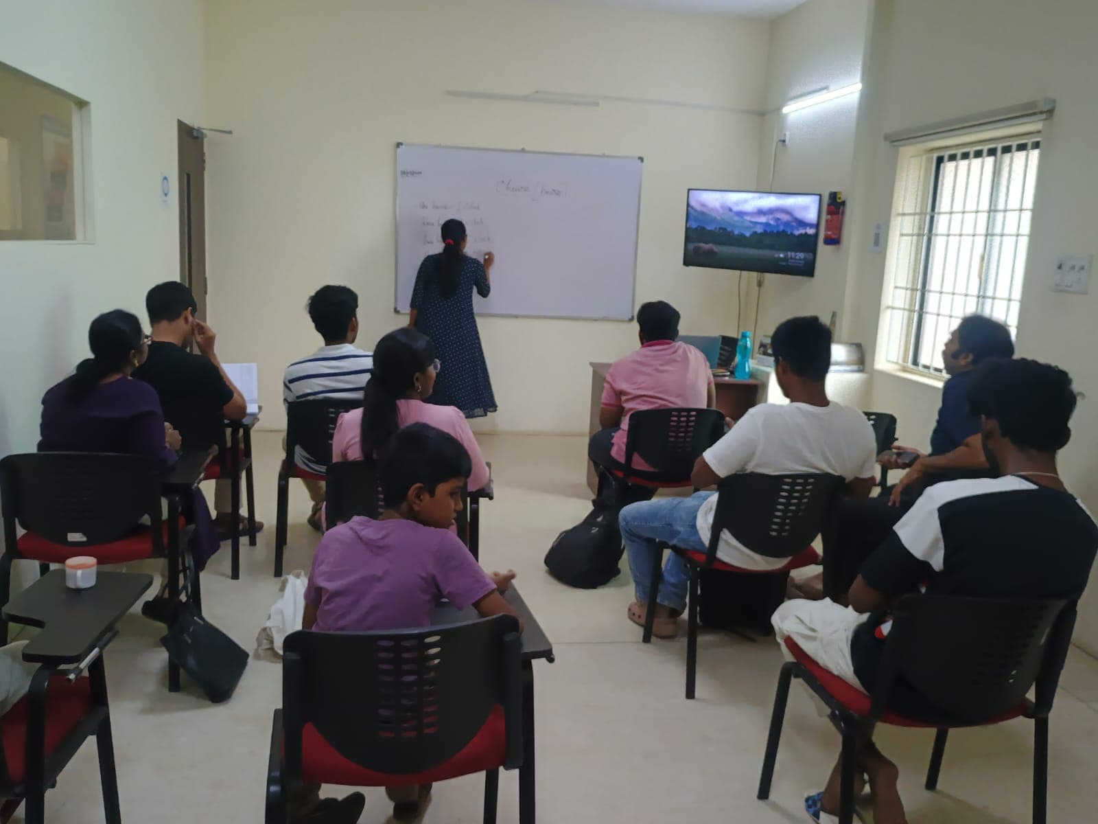 Small group lesson in a classroom with participants of different ages