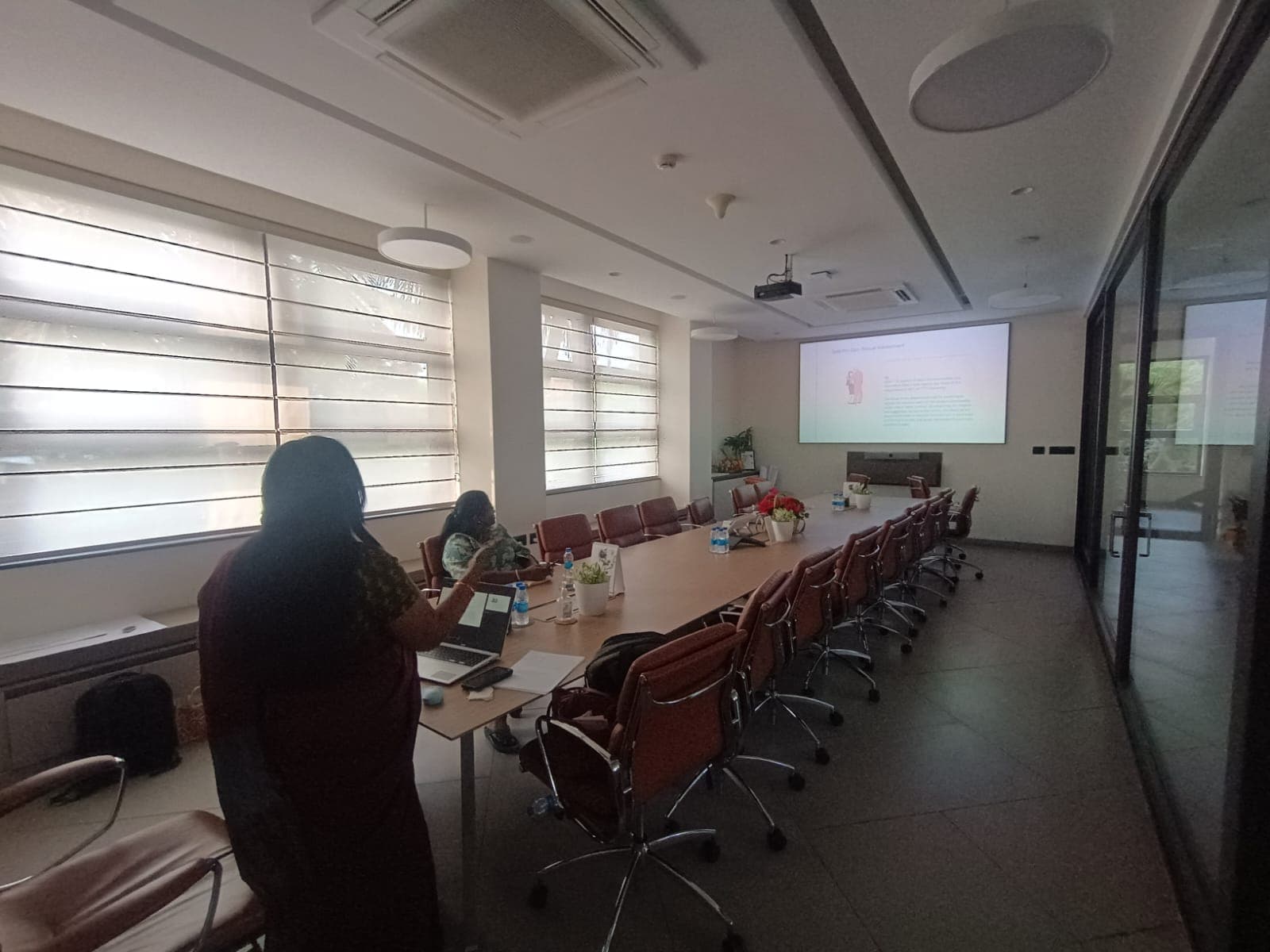Facilitators presenting a workplace awareness session in a corporate boardroom