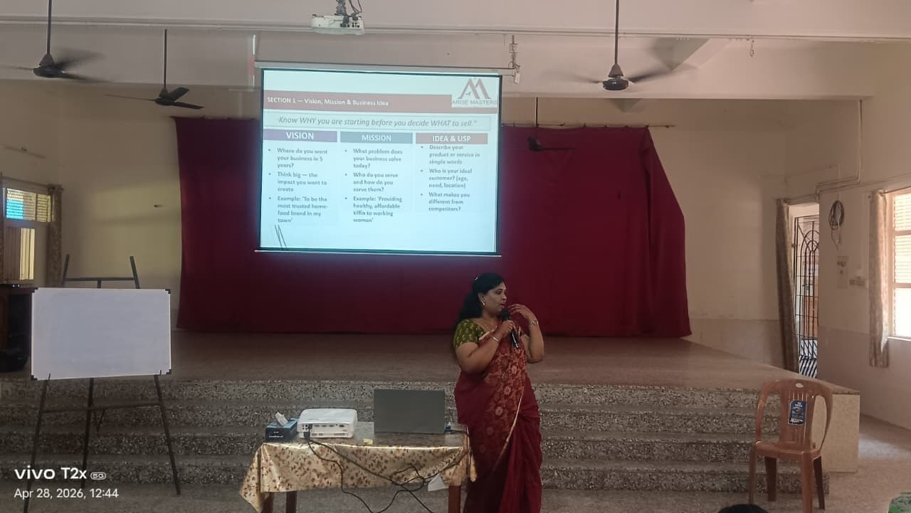 Facilitator presenting to a small group in a corporate boardroom